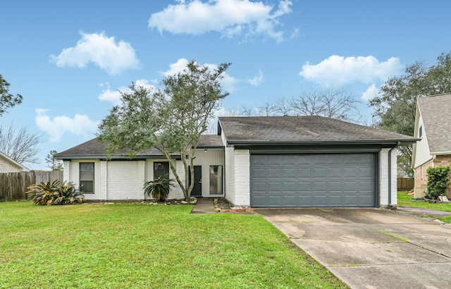 ranch-style home with a front yard, brick siding, and driveway