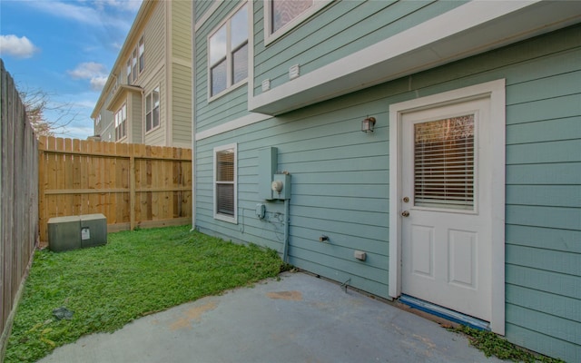 entrance to property with a patio area