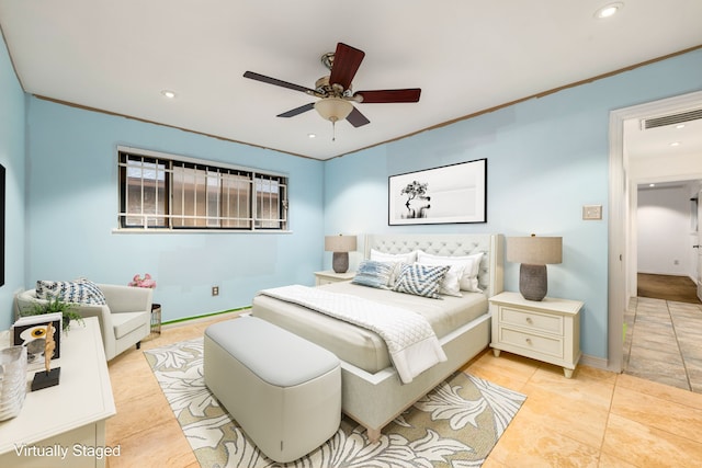 bedroom with ceiling fan and ornamental molding