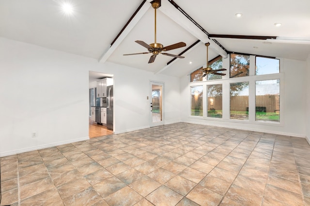 empty room with high vaulted ceiling and beam ceiling