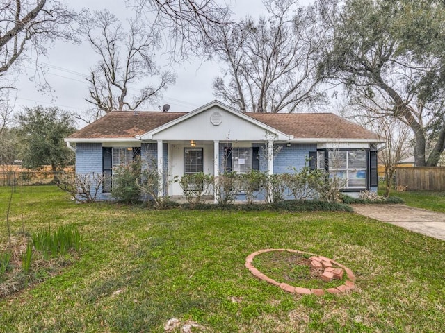 ranch-style home with a front lawn