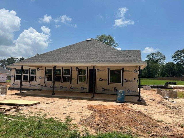 122 Luther Dean Ln, New Waverly, TX 77358 - rear view of property with roof with shingles