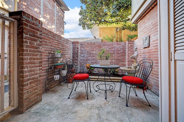 view of patio featuring fence