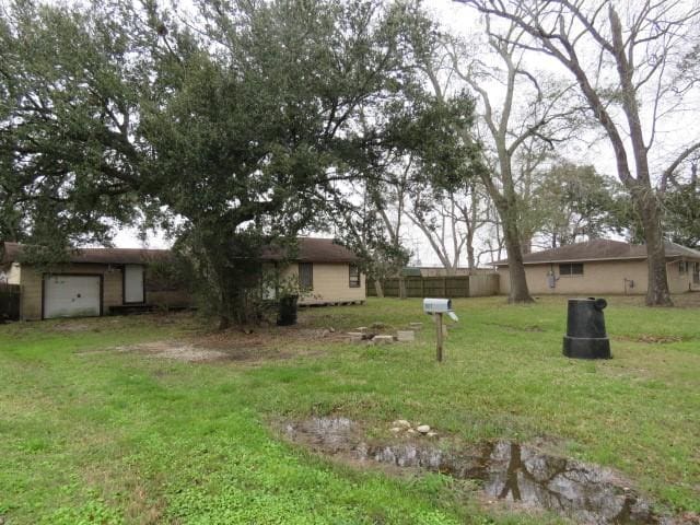 view of yard featuring a garage