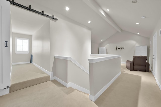 hall with a barn door, baseboards, light colored carpet, an upstairs landing, and recessed lighting