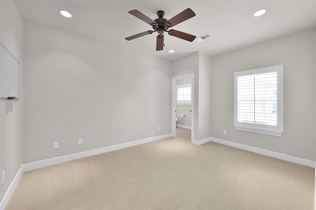 empty room featuring light carpet, baseboards, visible vents, ceiling fan, and recessed lighting