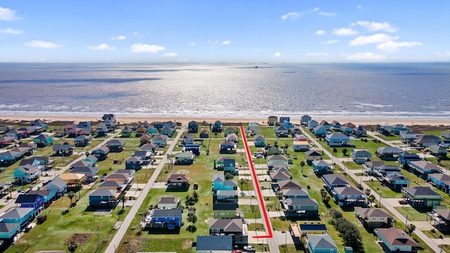 aerial view with a beach view and a water view