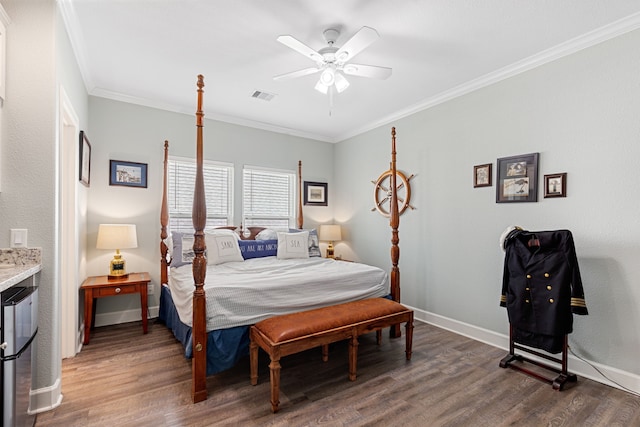 bedroom featuring ornamental molding, dark hardwood / wood-style floors, and ceiling fan