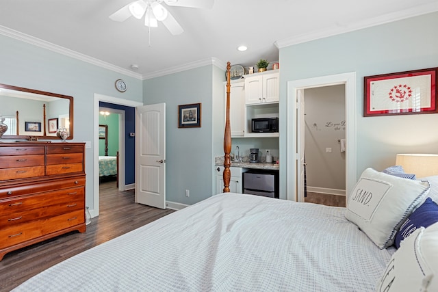 bedroom with dark hardwood / wood-style flooring, ceiling fan, and crown molding