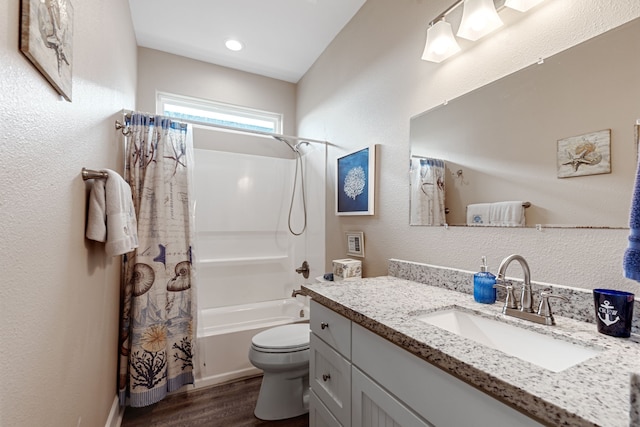 full bathroom with toilet, hardwood / wood-style flooring, vanity, and shower / bath combination with curtain