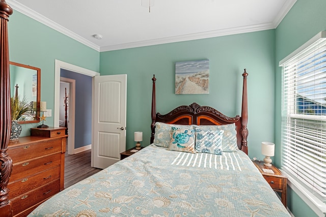 bedroom featuring dark hardwood / wood-style flooring and crown molding