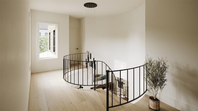 hallway with light hardwood / wood-style floors