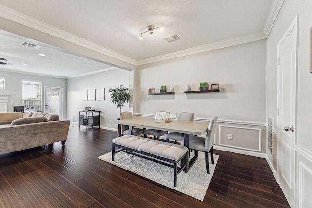 dining area featuring crown molding and dark hardwood / wood-style flooring