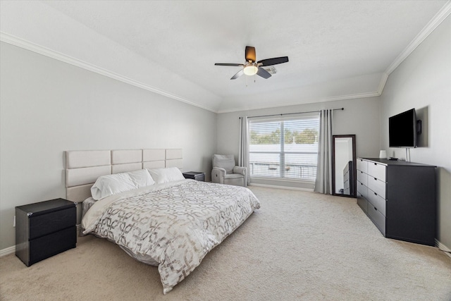 carpeted bedroom with ceiling fan and ornamental molding