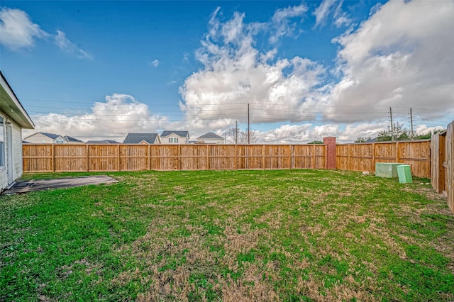 view of yard with a fenced backyard