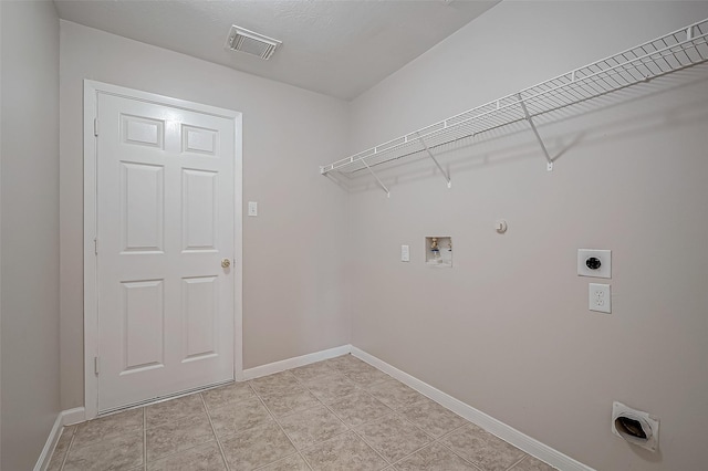 laundry area with laundry area, visible vents, gas dryer hookup, hookup for an electric dryer, and washer hookup