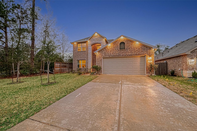 view of front of home featuring a garage and a front lawn