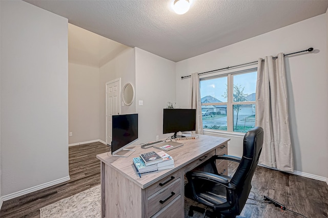 office featuring a textured ceiling and dark hardwood / wood-style floors