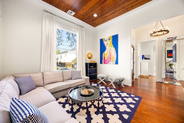 living room featuring visible vents, wooden ceiling, dark wood-style floors, ornamental molding, and an inviting chandelier