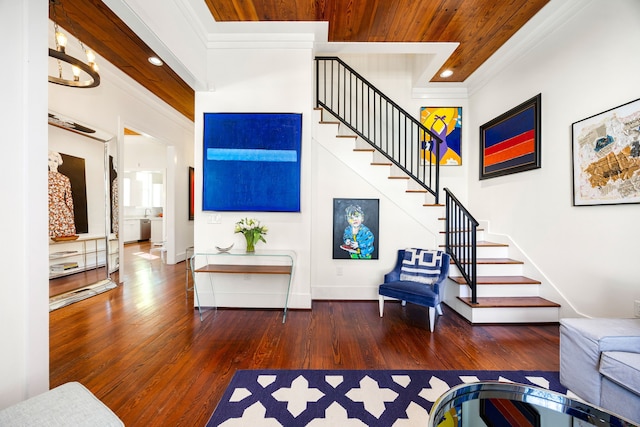 interior space featuring dark wood finished floors, wood ceiling, stairs, crown molding, and recessed lighting