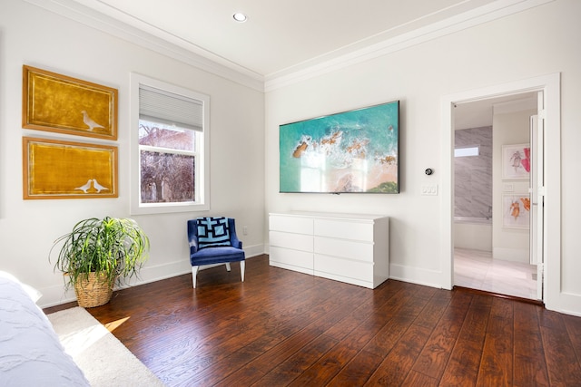 sitting room with crown molding, baseboards, dark wood-type flooring, and recessed lighting