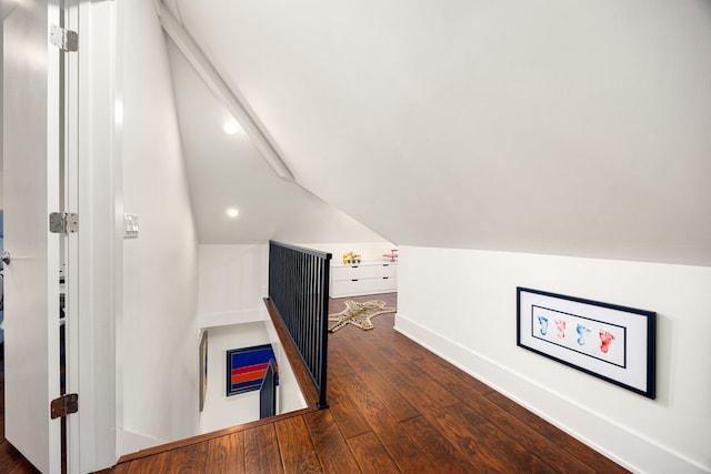 bonus room with lofted ceiling, baseboards, and dark wood-style flooring