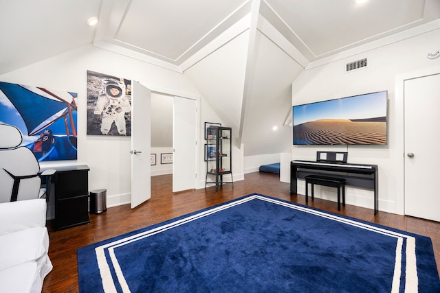 bedroom featuring dark wood-style flooring, visible vents, vaulted ceiling, and baseboards