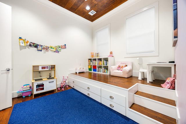 playroom with wooden ceiling, recessed lighting, dark wood-style flooring, visible vents, and crown molding