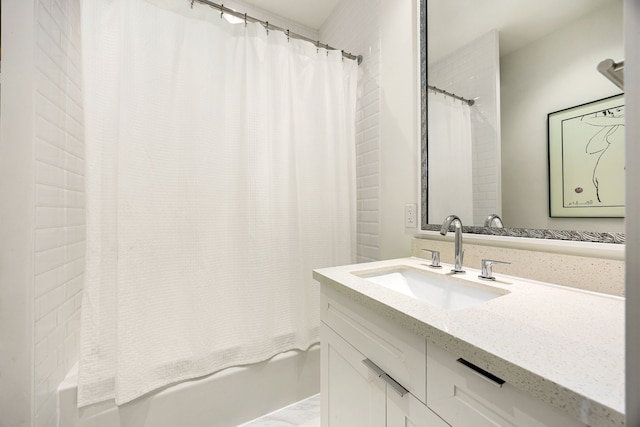 bathroom featuring vanity and shower / bath combo with shower curtain