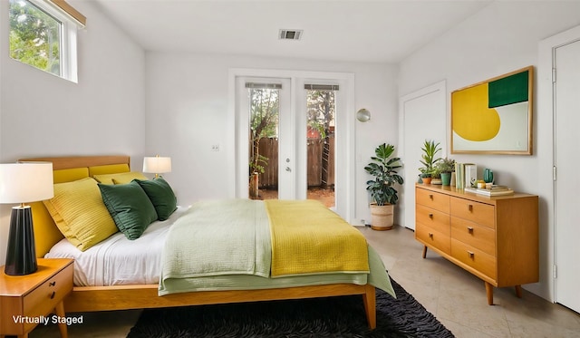 bedroom featuring french doors and access to outside