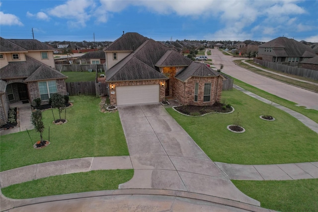 view of front facade featuring driveway, brick siding, fence, and a residential view