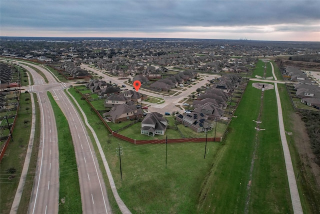 birds eye view of property with a residential view