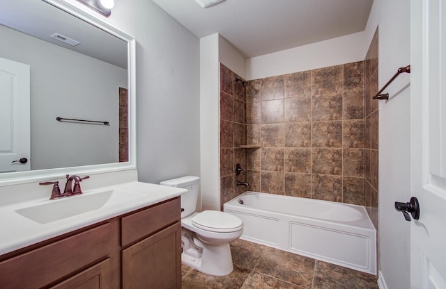 full bathroom featuring visible vents, toilet, bathing tub / shower combination, and vanity