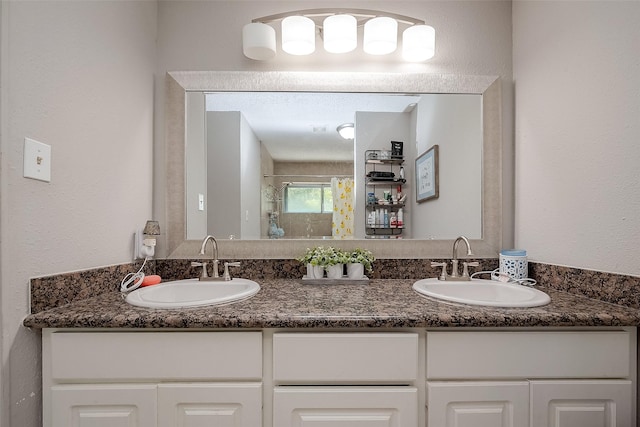 8619 Quail Burg Ln, Houston, TX 77489 - bathroom featuring double vanity and a shower stall