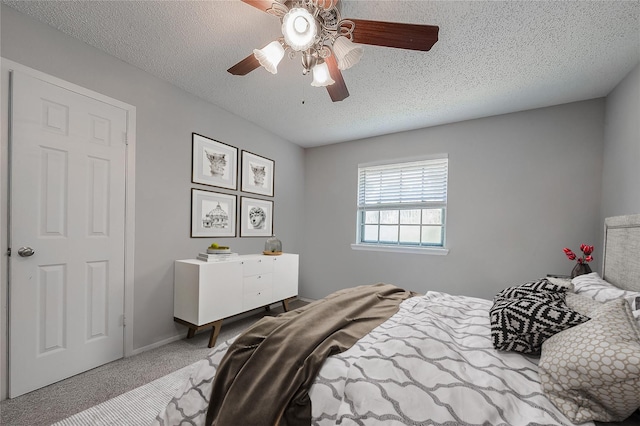 8619 Quail Burg Ln, Houston, TX 77489 - bedroom featuring carpet floors, a textured ceiling, and a ceiling fan