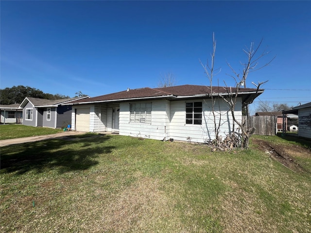 view of front of property with a front lawn and a garage