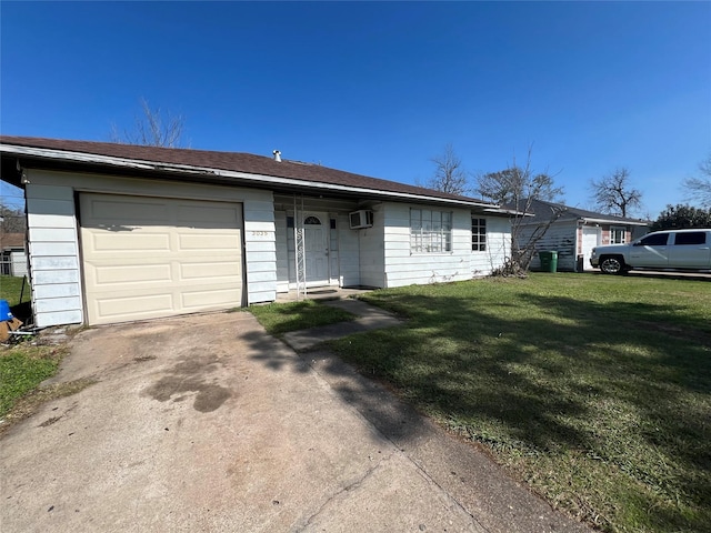 ranch-style home featuring a wall unit AC, a front yard, and a garage