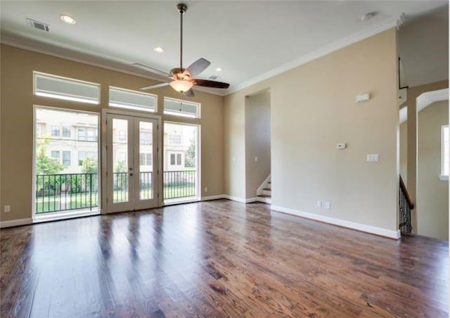 spare room with french doors, crown molding, dark hardwood / wood-style floors, and ceiling fan