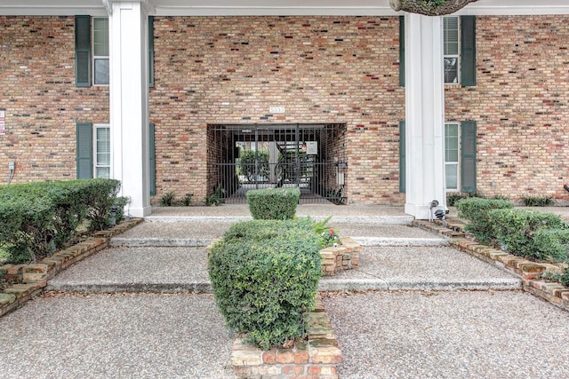 entrance to property with brick siding