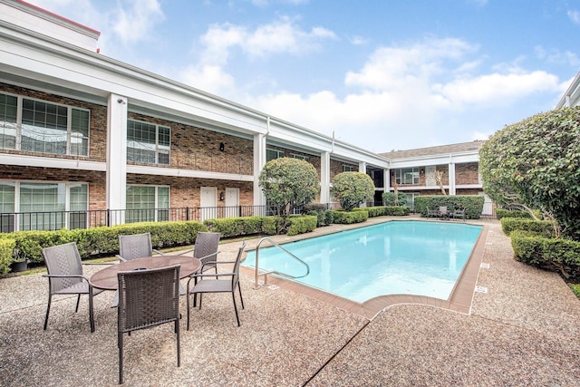 community pool with a patio