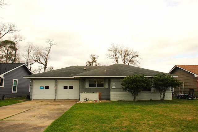 view of front of house with a garage and a front yard