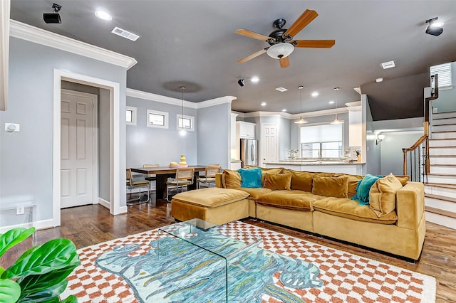 living room with ceiling fan, wood-type flooring, and crown molding