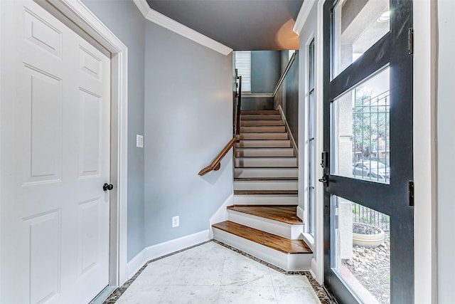 staircase featuring crown molding