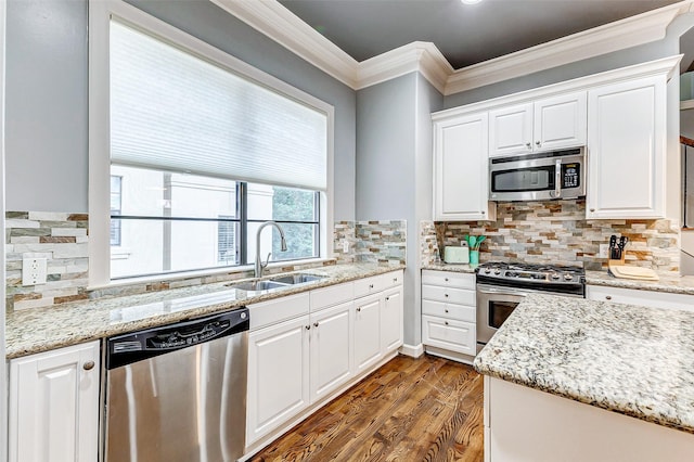 kitchen featuring sink, stainless steel appliances, light stone countertops, and white cabinets