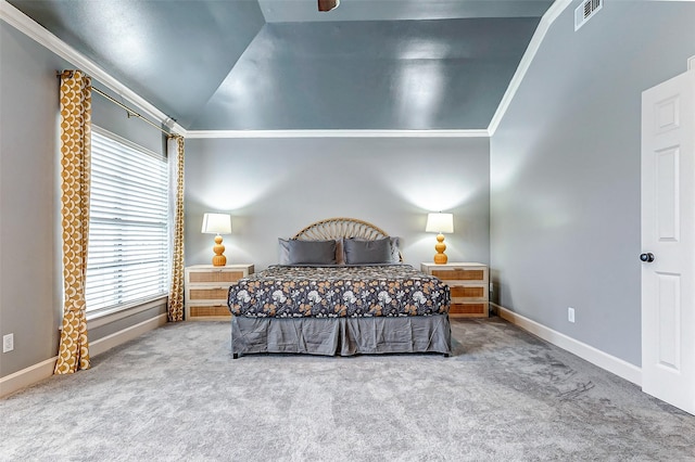 carpeted bedroom with ceiling fan, vaulted ceiling, and crown molding