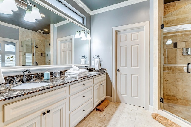 bathroom featuring ornamental molding, vanity, tile patterned flooring, and an enclosed shower