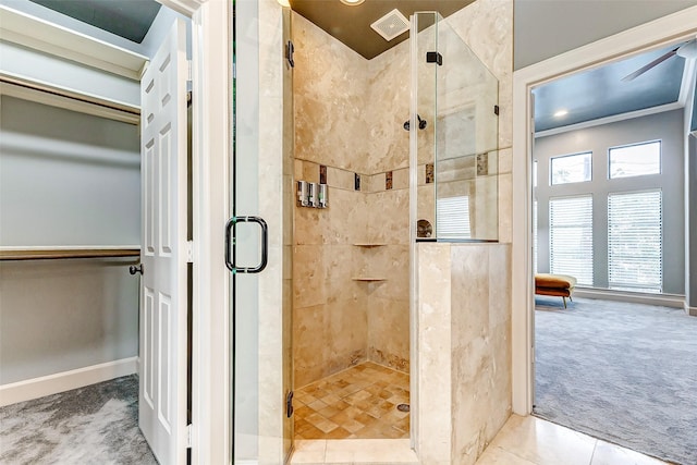 bathroom with tile patterned flooring and walk in shower