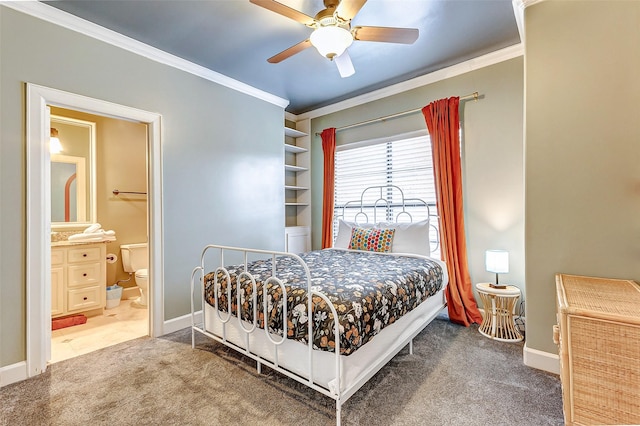 bedroom with ceiling fan, ensuite bath, crown molding, and carpet floors