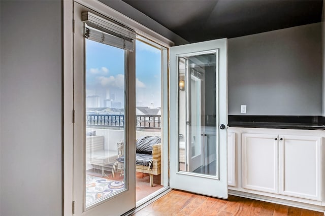 doorway to outside with light hardwood / wood-style flooring