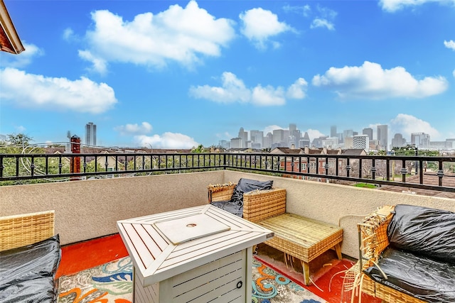 view of patio featuring a balcony